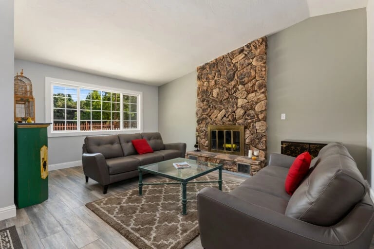 Cozy living room with stone fireplace and modern decor